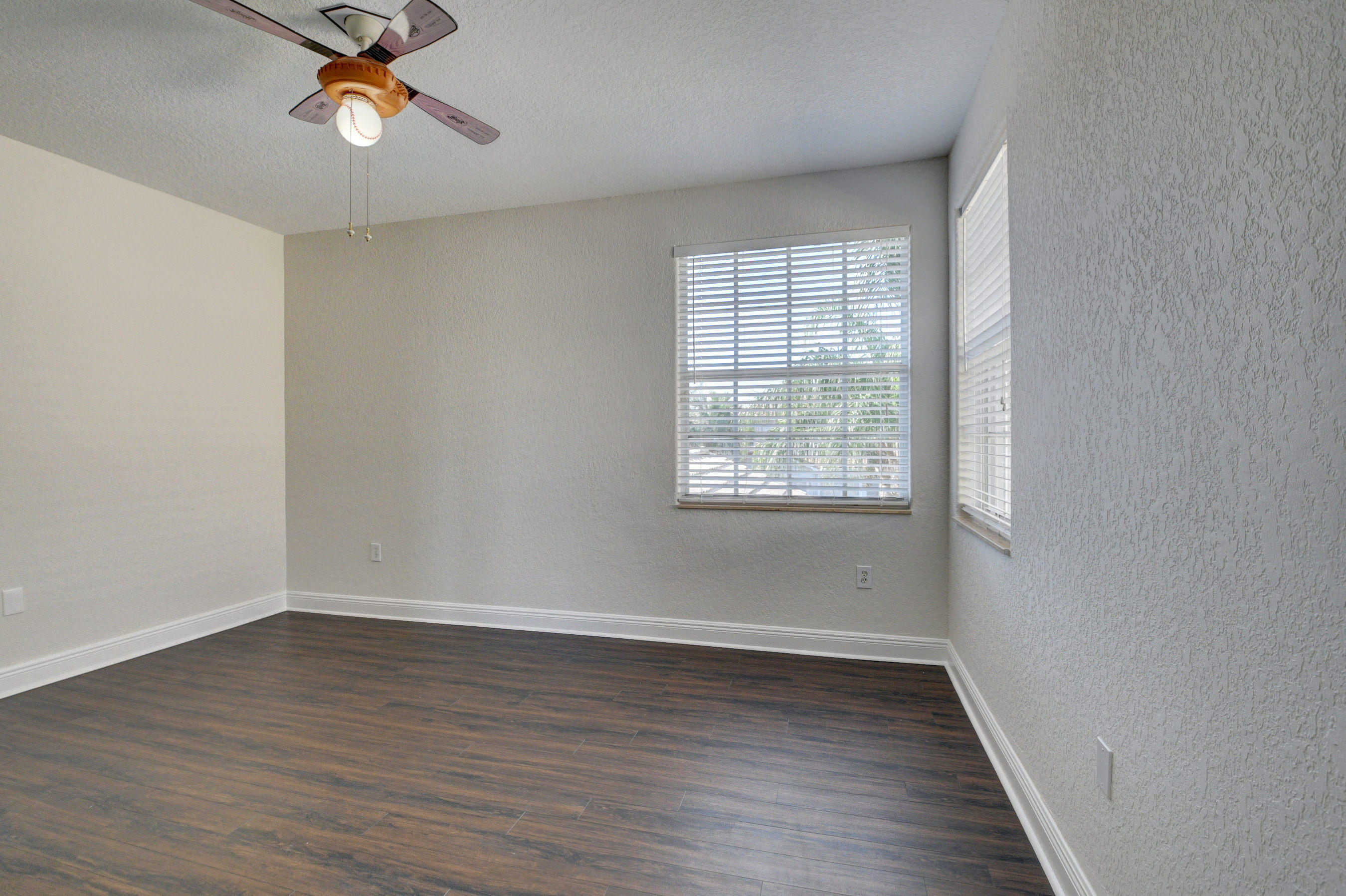 11785 Preservation Lane Boca Raton, FL 33498 - Photo 30 of 53 wooden floor in an empty room with a window