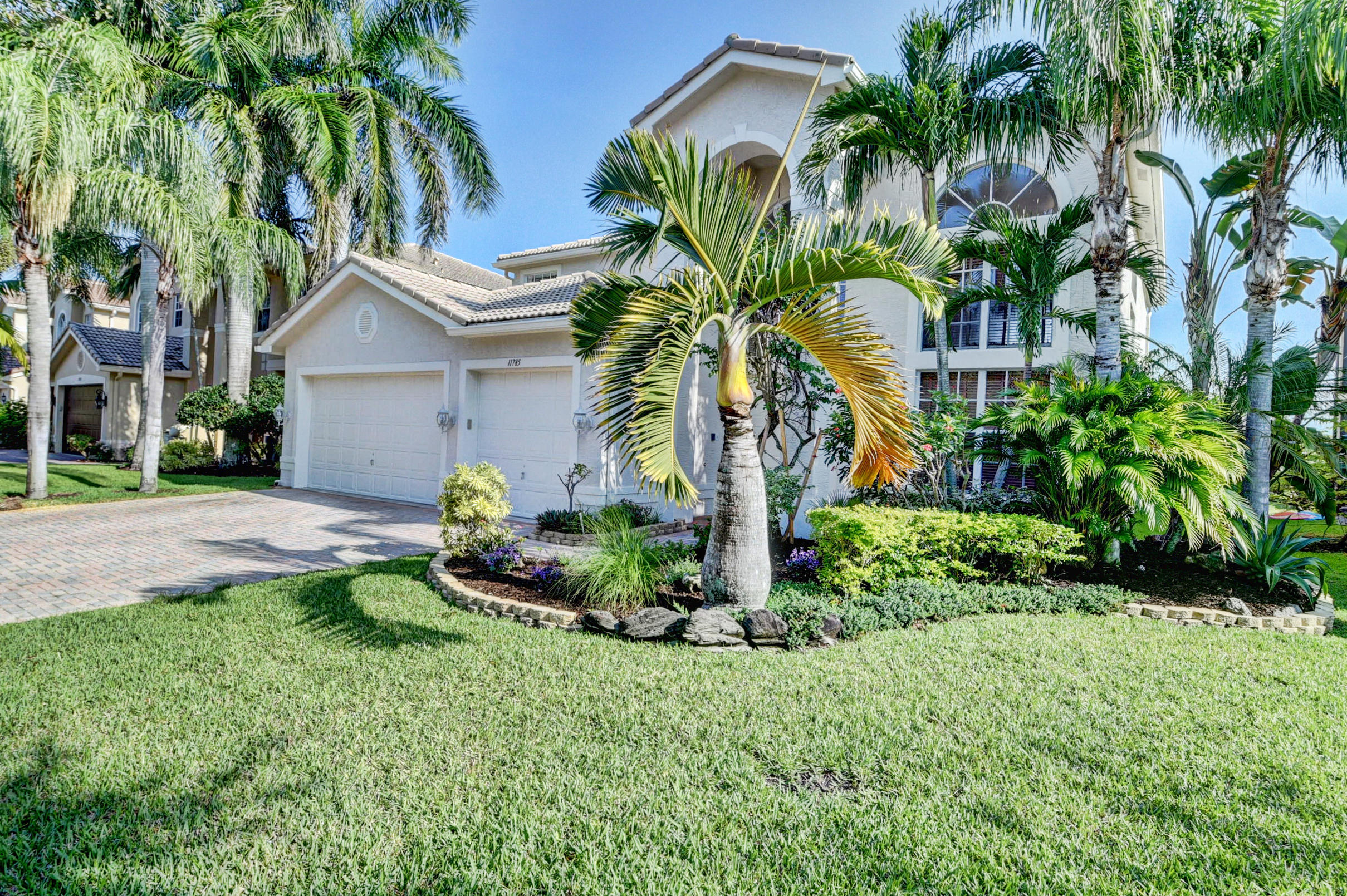 11785 Preservation Lane Boca Raton, FL 33498 - Photo 3 of 53 a front view of house with yard and green space