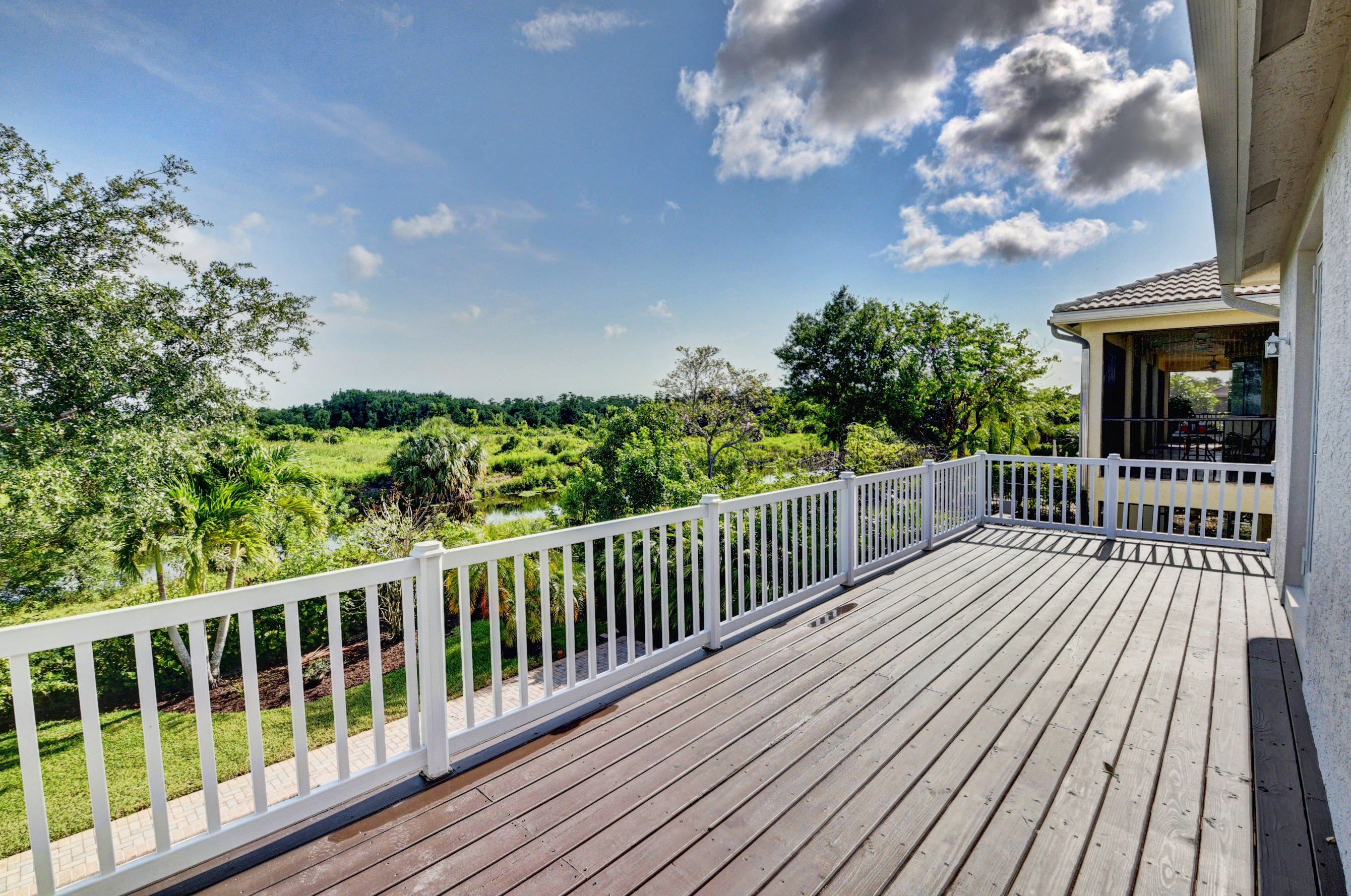 11785 Preservation Lane Boca Raton, FL 33498 - Photo 32 of 53 a view of a balcony with wooden floor