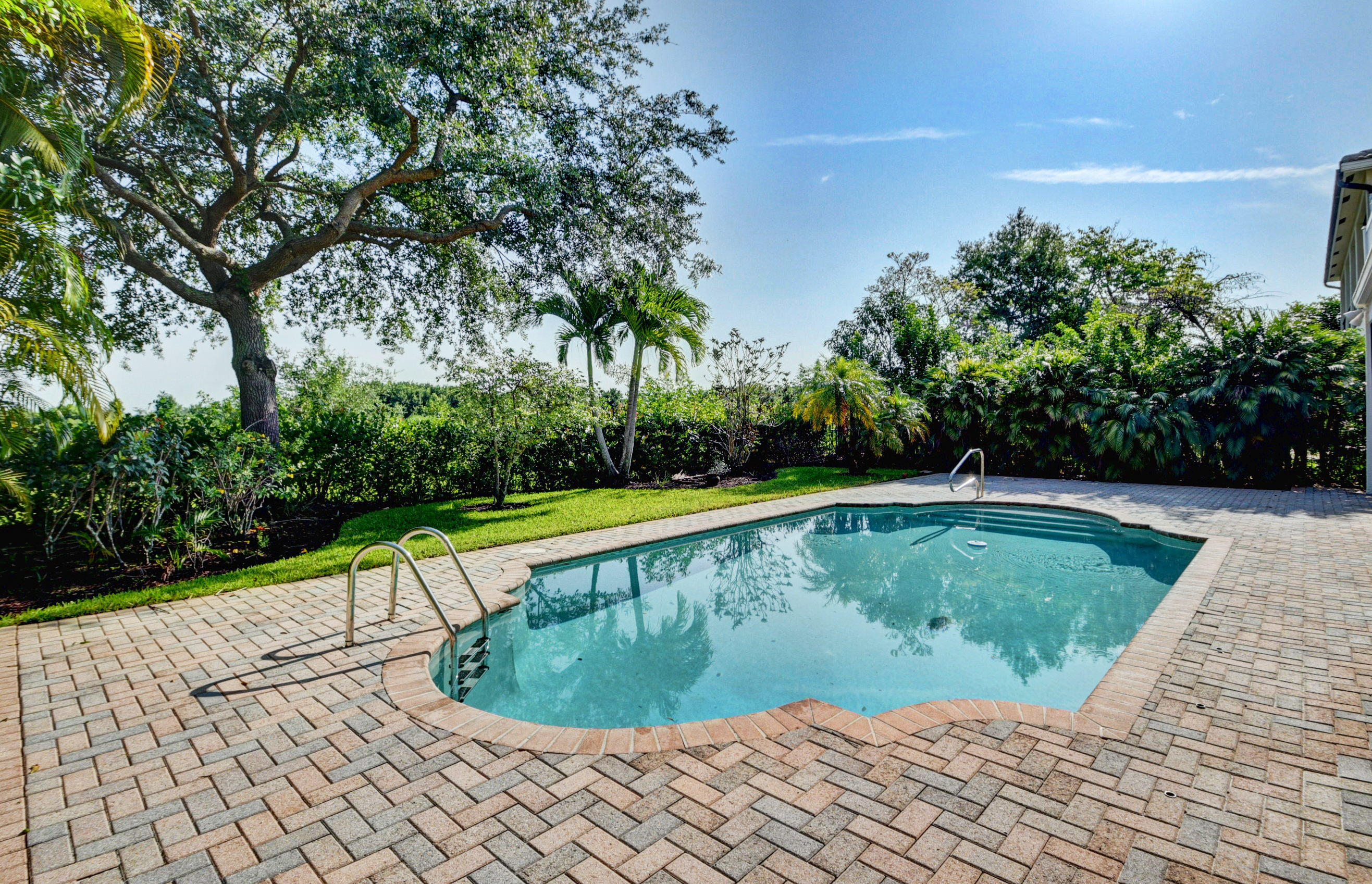 11785 Preservation Lane Boca Raton, FL 33498 - Photo 37 of 53 a view of a swimming pool with a yard