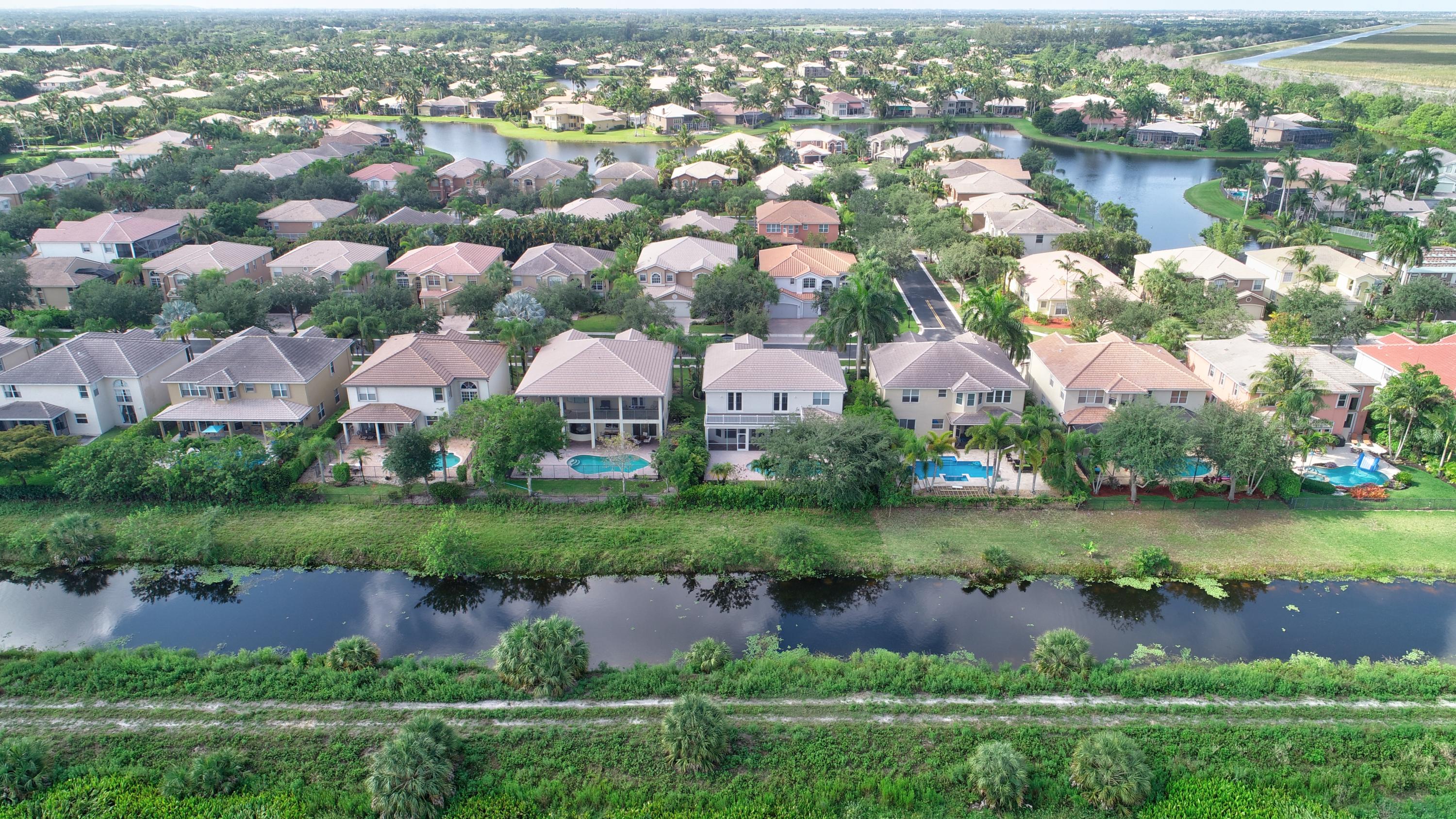 11785 Preservation Lane Boca Raton, FL 33498 - Photo 49 of 53 a view of a lake with a houses