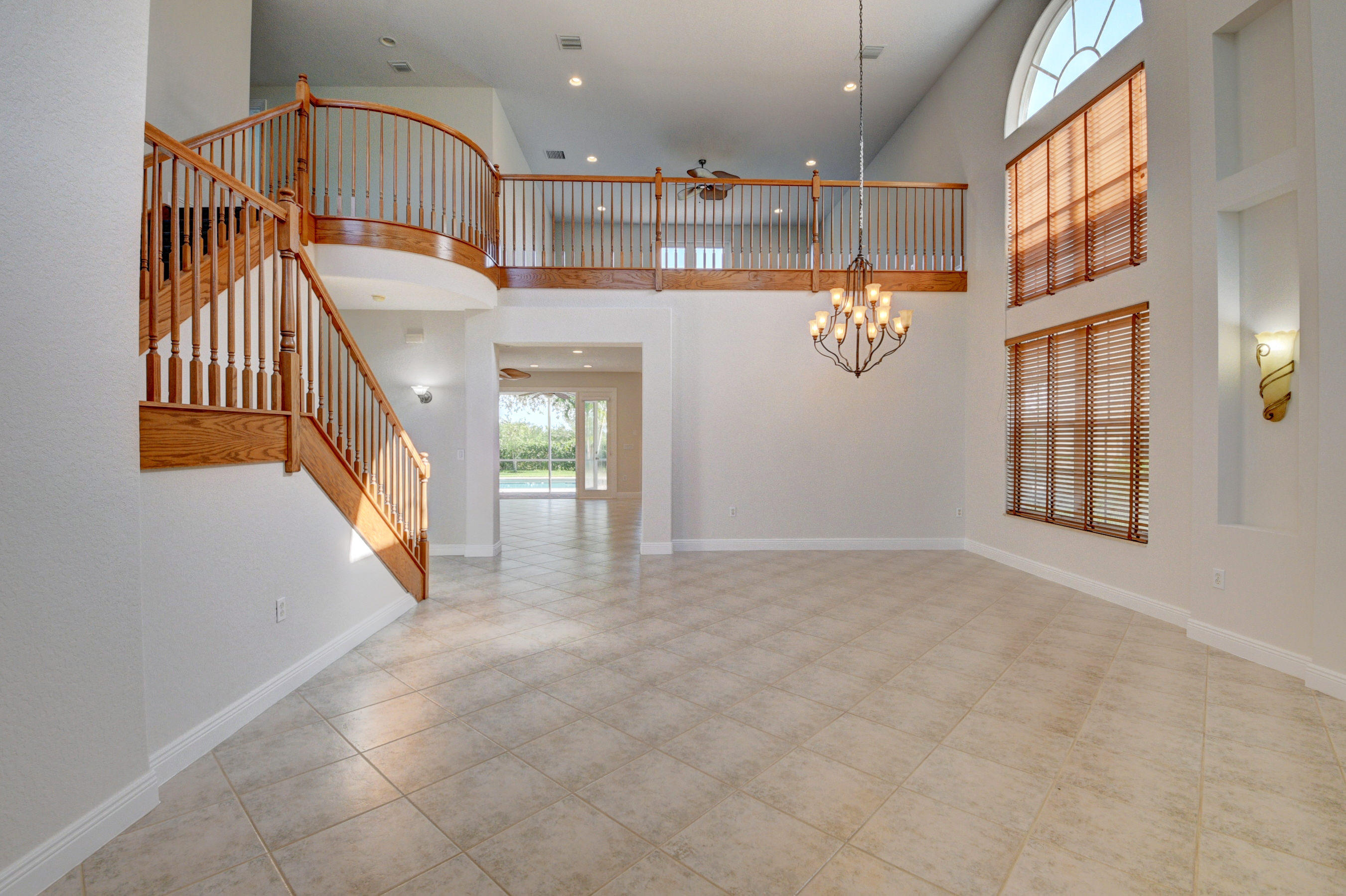 11785 Preservation Lane Boca Raton, FL 33498 - Photo 5 of 53 a view of entryway and hall with wooden floor