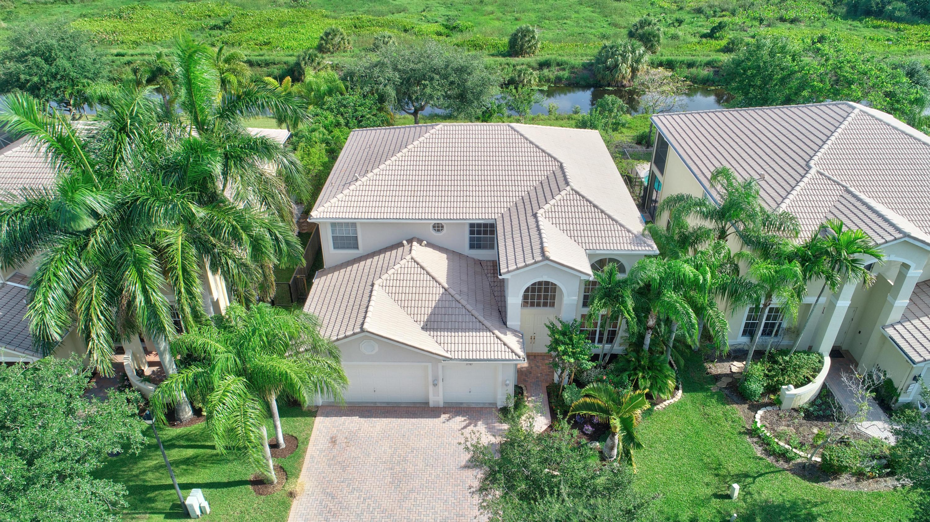 11785 Preservation Lane Boca Raton, FL 33498 - Photo 52 of 53 an aerial view of a house with yard and outdoor seating