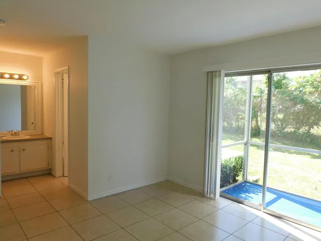 a bathroom with a bath tub with a shower
