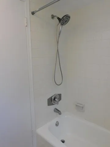 a green field with trees in the background