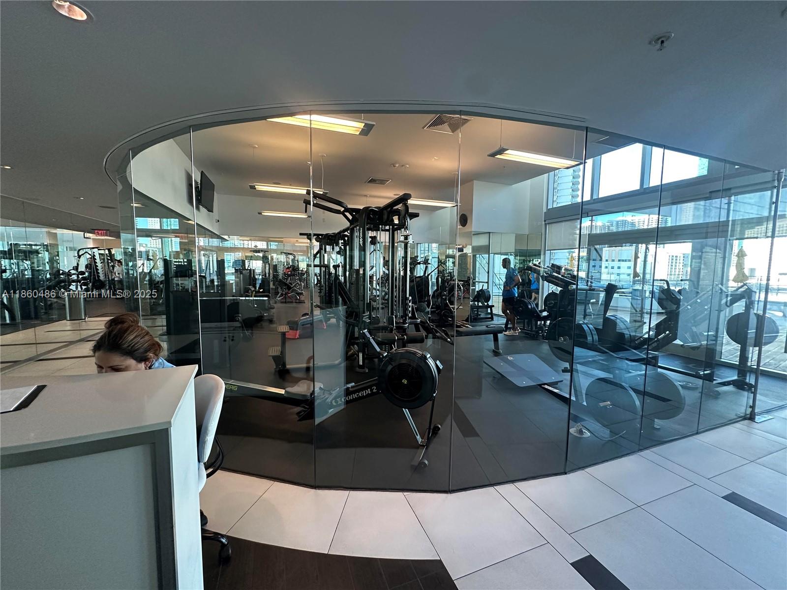 92 Southwest 3rd Street, Unit 1908 Miami, FL 33130 - Photo 12 of 18 a view of a room with gym equipment