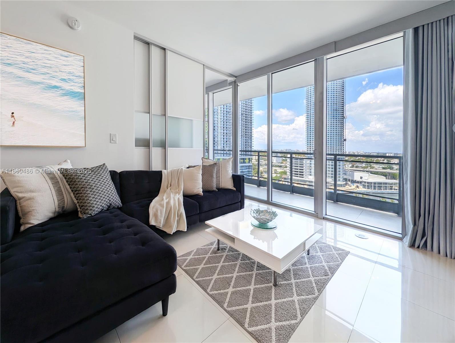 92 Southwest 3rd Street, Unit 1908 Miami, FL 33130 - Photo 6 of 18 a living room with furniture large windows and wooden floor