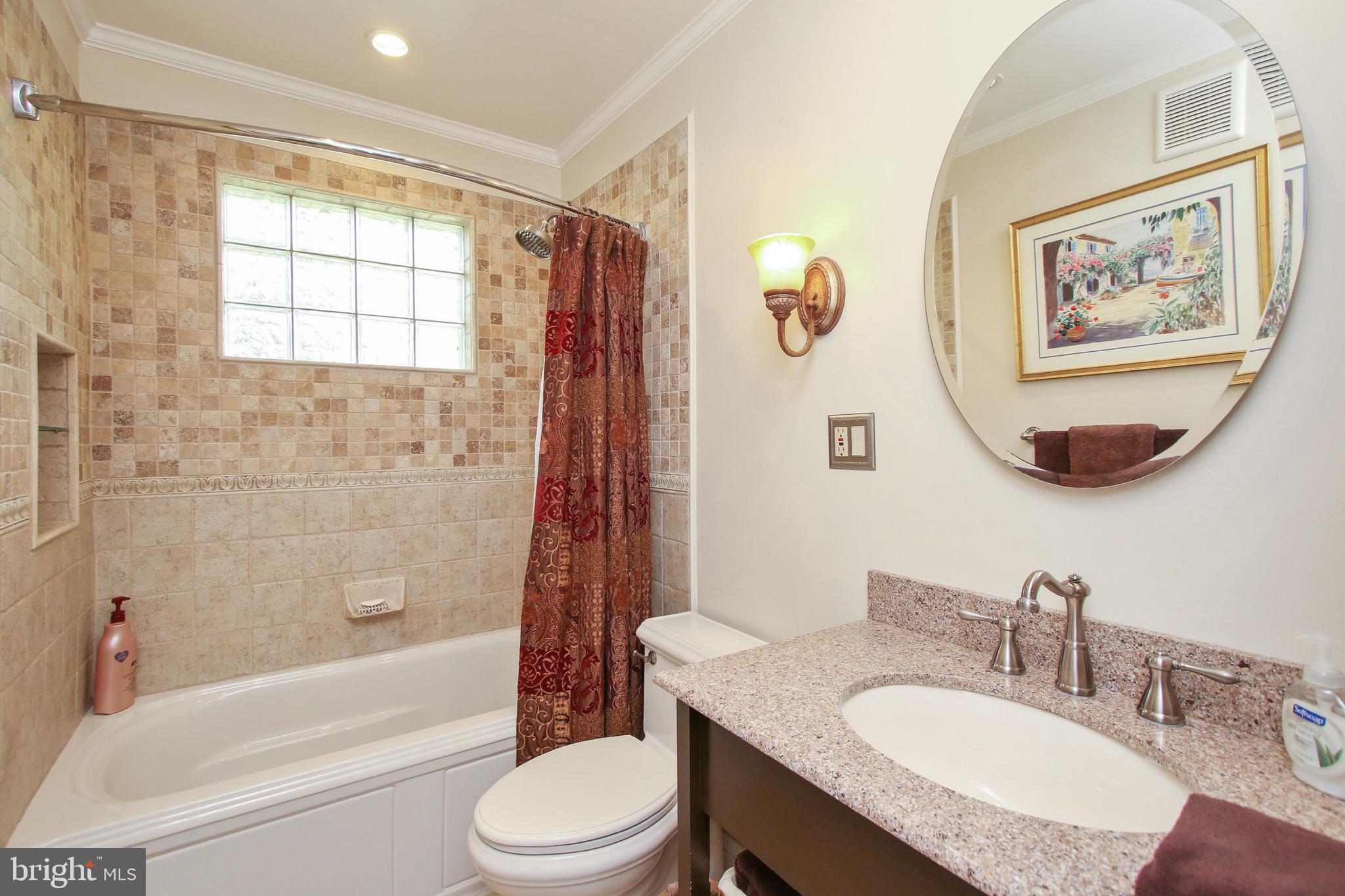 8409 West Grove Road Ellicott City, MD 21043 - Photo 15 of 35 Updated Bath with silestone vanity & tiled shower