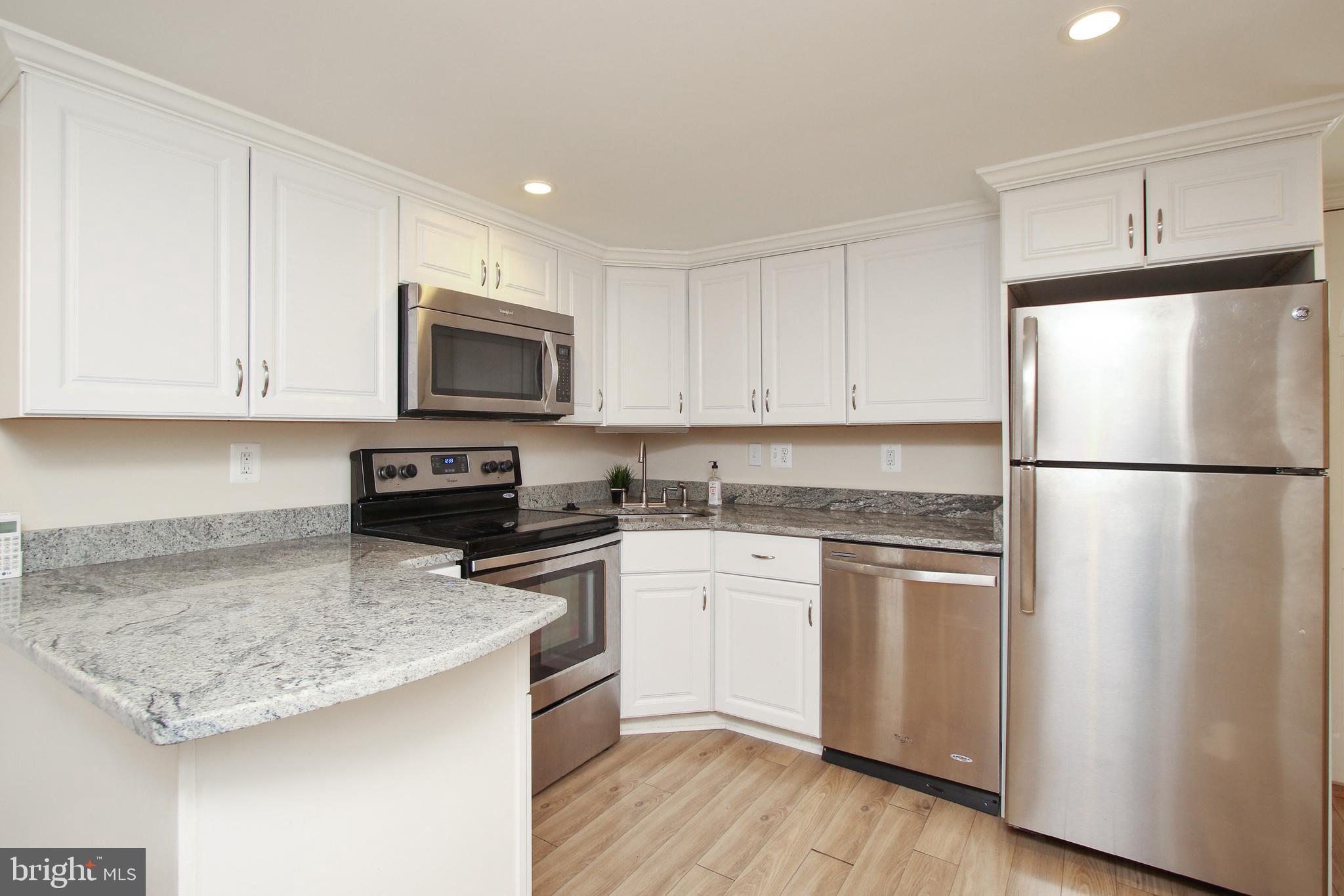 8409 West Grove Road Ellicott City, MD 21043 - Photo 26 of 35 Stainless appliances and granite counters