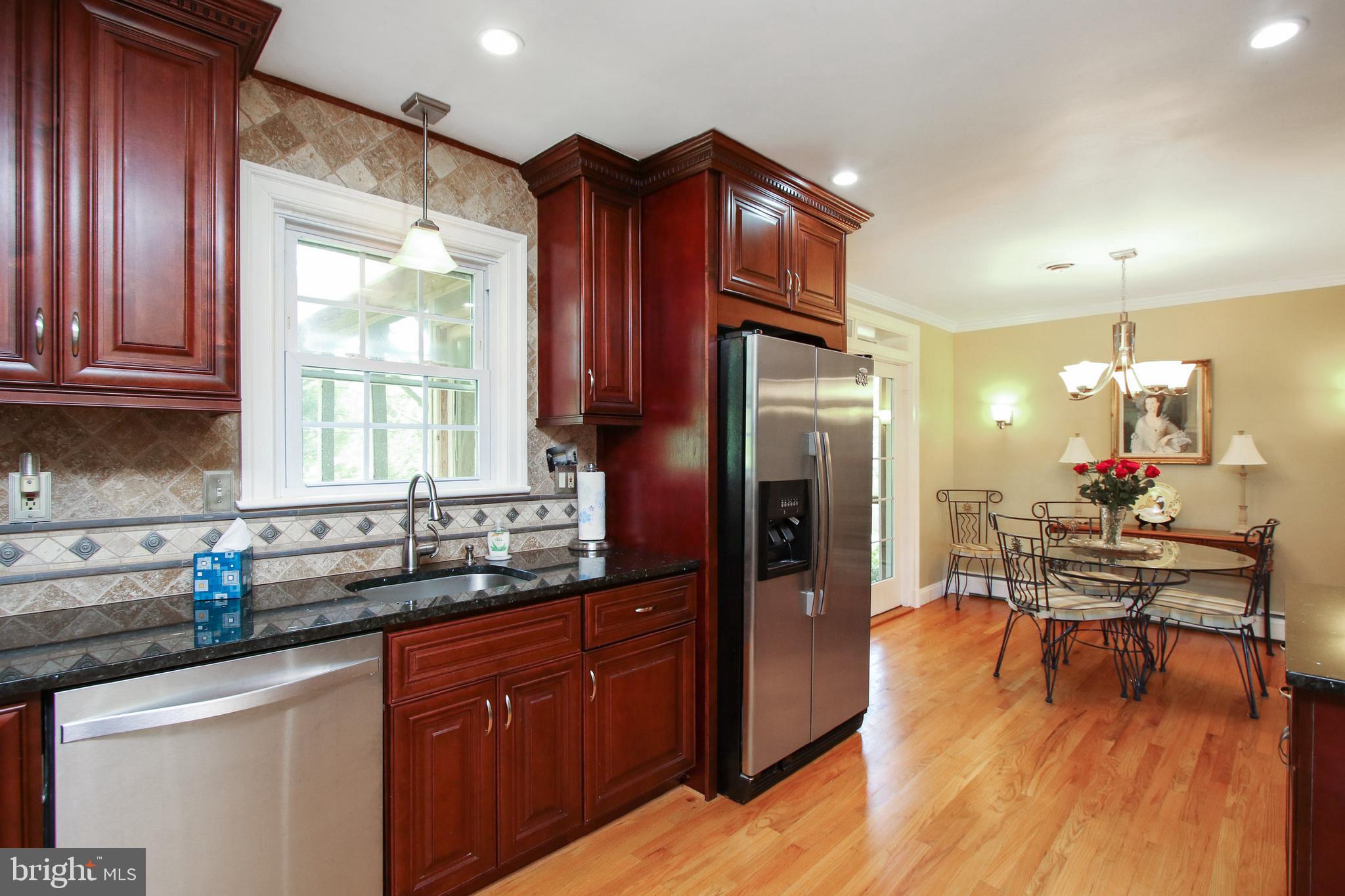 8409 West Grove Road Ellicott City, MD 21043 - Photo 9 of 35 Features granite counters & tile backsplash