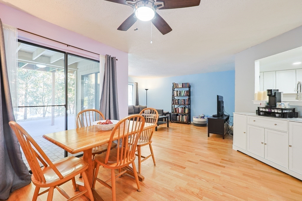 276 Trailside Way, Unit 276 Ashland, MA 01721 - Photo 14 of 32 a view of a dining room with furniture window and outside view