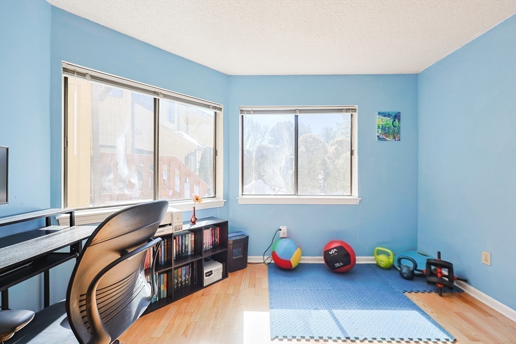 276 Trailside Way, Unit 276 Ashland, MA 01721 - Photo 19 of 32 a view of a dining room with furniture and a window