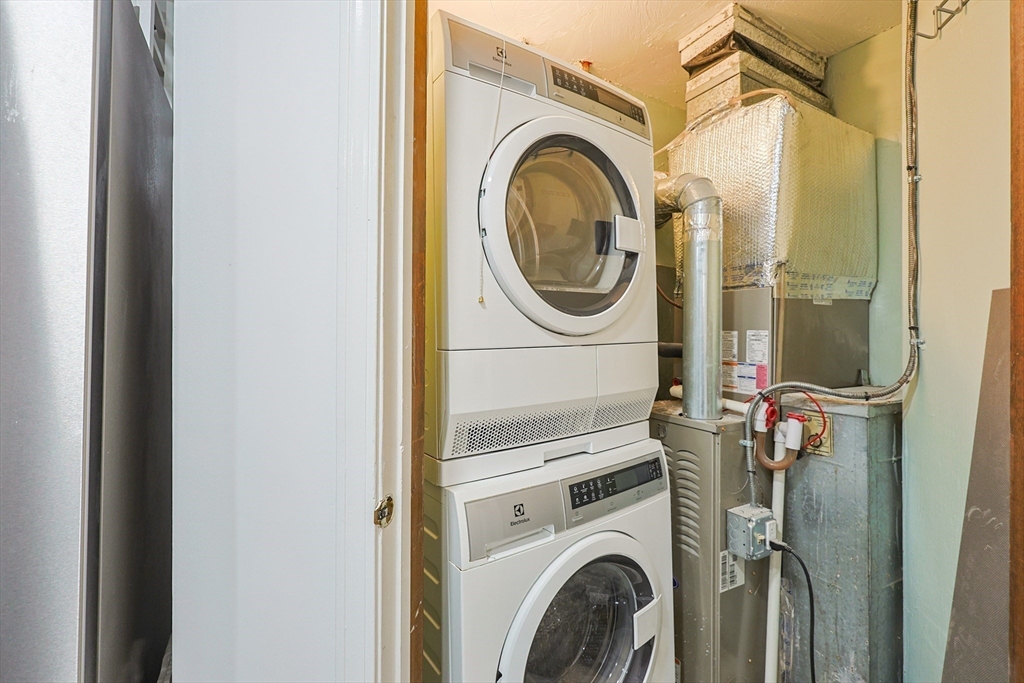 276 Trailside Way, Unit 276 Ashland, MA 01721 - Photo 24 of 32 a utility room with dryer and washer