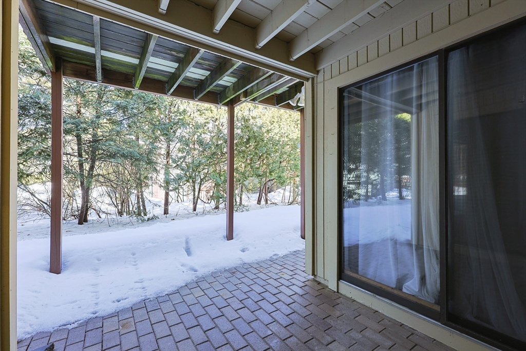 276 Trailside Way, Unit 276 Ashland, MA 01721 - Photo 26 of 32 a view of empty room with wooden floor and door