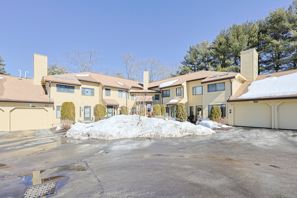 276 Trailside Way, Unit 276 Ashland, MA 01721 - Photo 31 of 32 a front view of a house with a yard