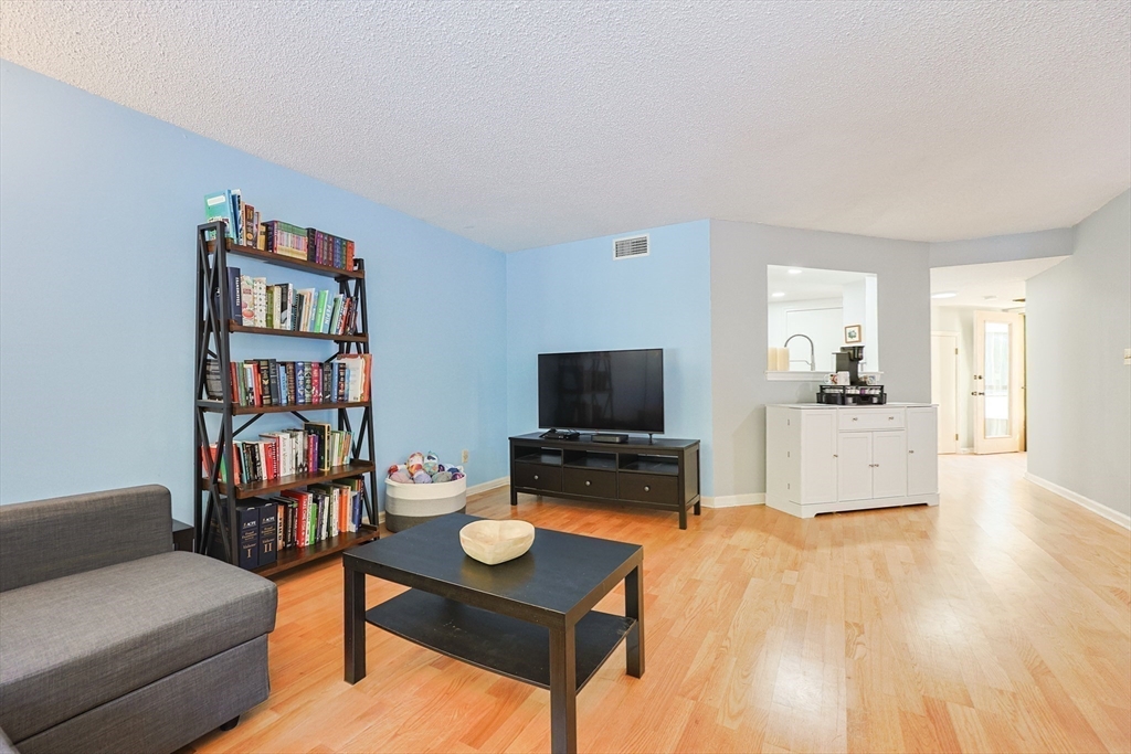 276 Trailside Way, Unit 276 Ashland, MA 01721 - Photo 10 of 32 a living room with furniture and a flat screen tv