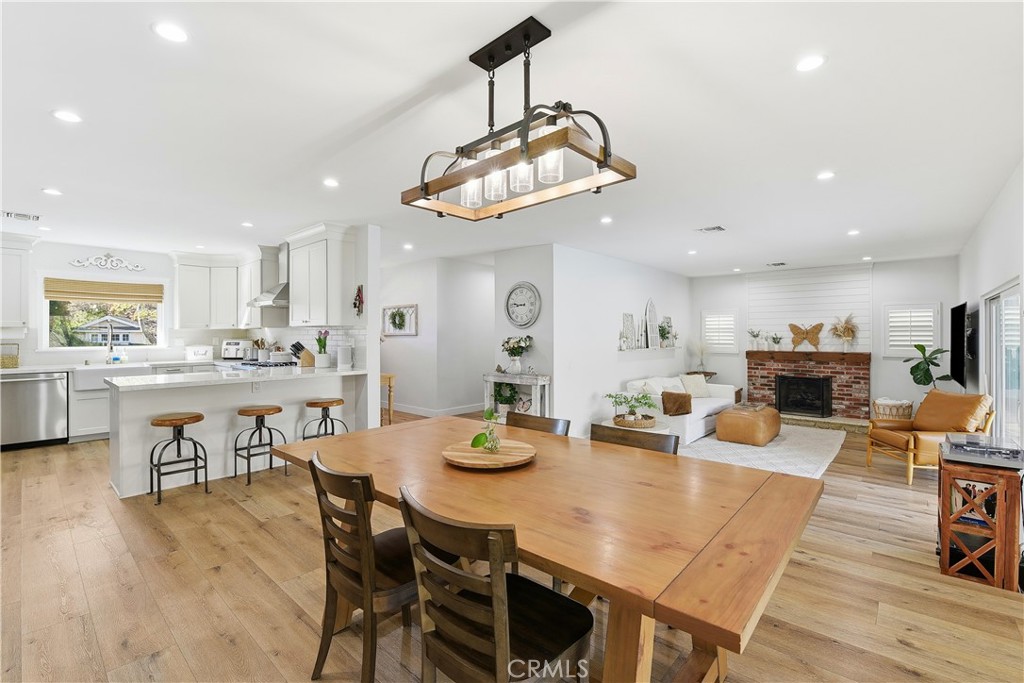 10560 Limerick Avenue Chatsworth, CA 91311 - Photo 17 of 43 a view of a dining room with furniture and wooden floor