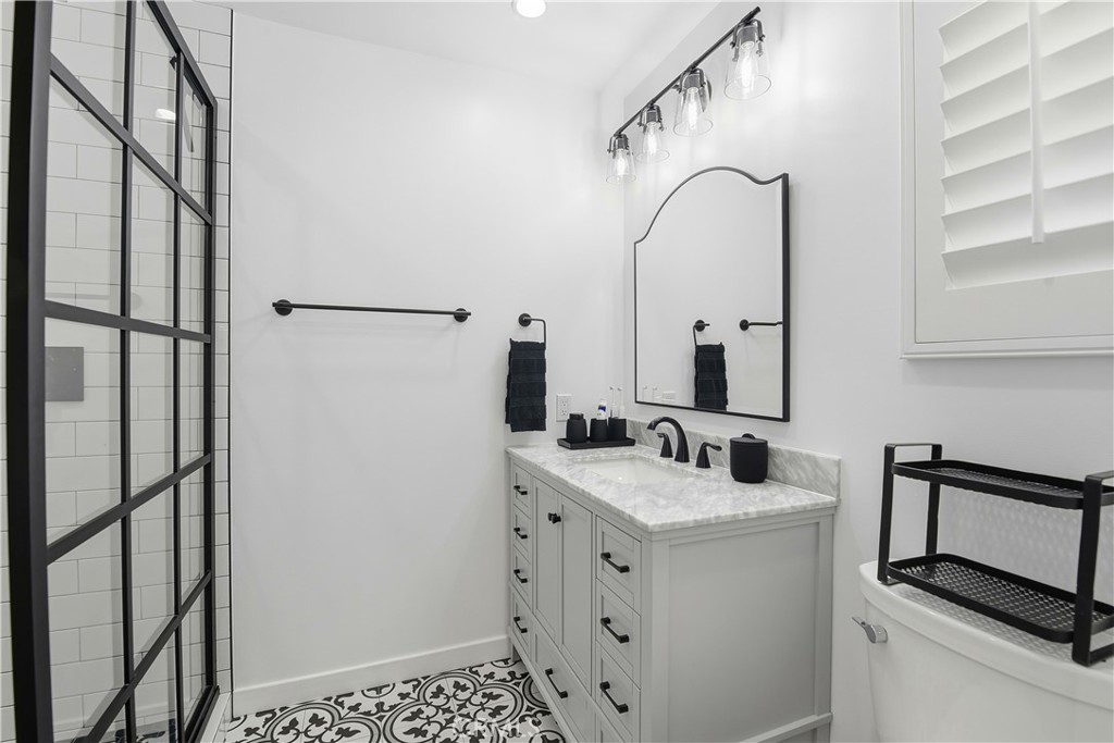 10560 Limerick Avenue Chatsworth, CA 91311 - Photo 27 of 43 a bathroom with a sink and a mirror