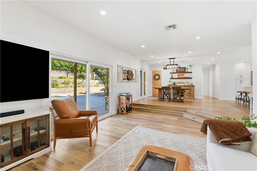 10560 Limerick Avenue Chatsworth, CA 91311 - Photo 8 of 43 a living room with furniture and a flat screen tv