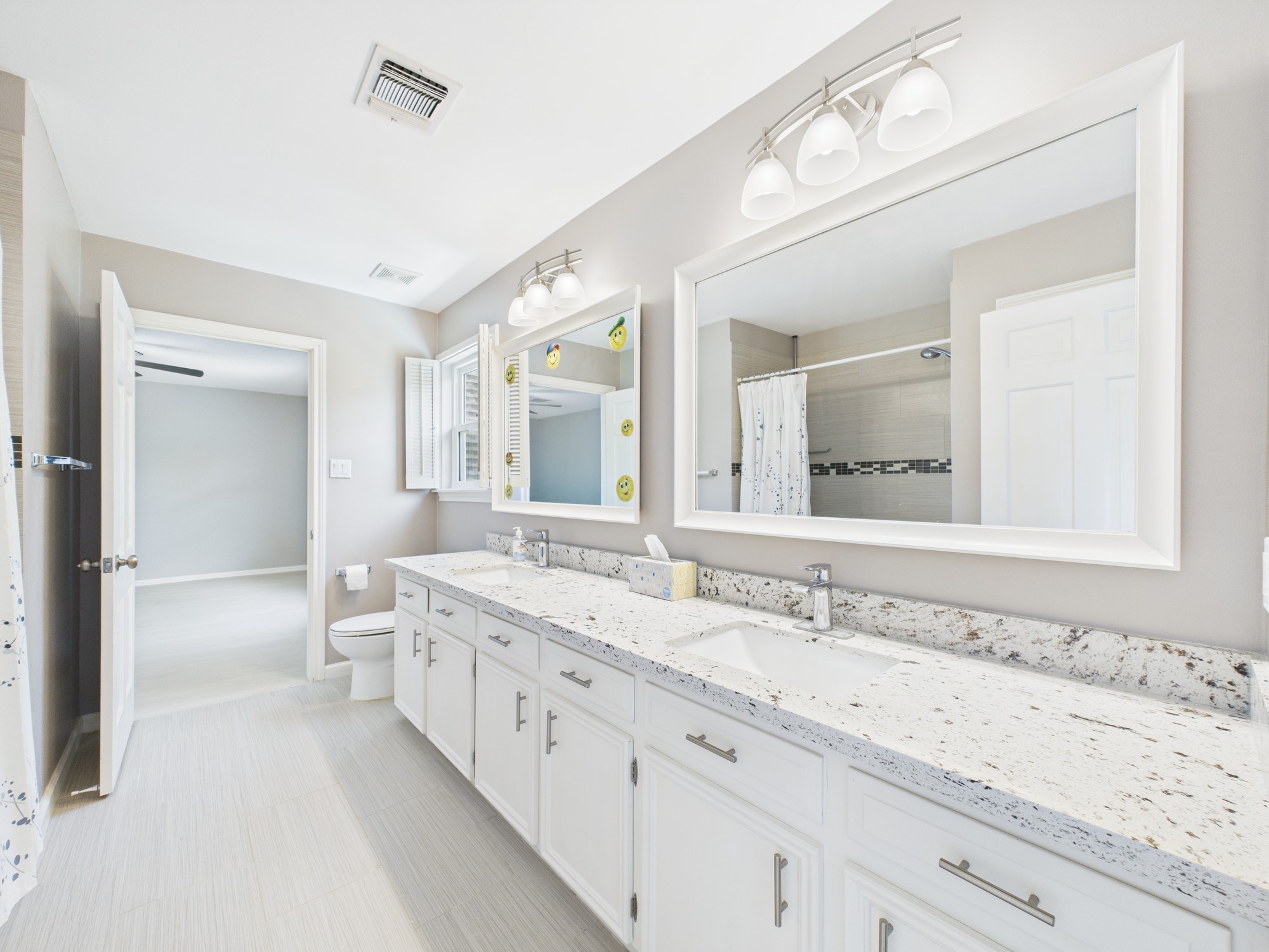 702 Daria Court Houston, TX 77079 - Photo 33 of 44 Spacious Jack-n-Jill Bath with Huge Double Vanity and Tub/Shower Combo