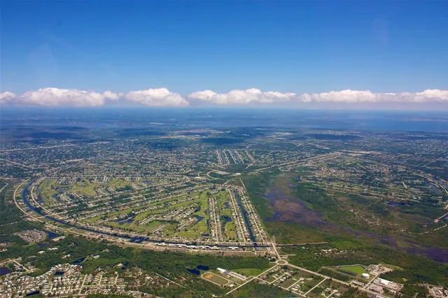 a view of a lake with a yard