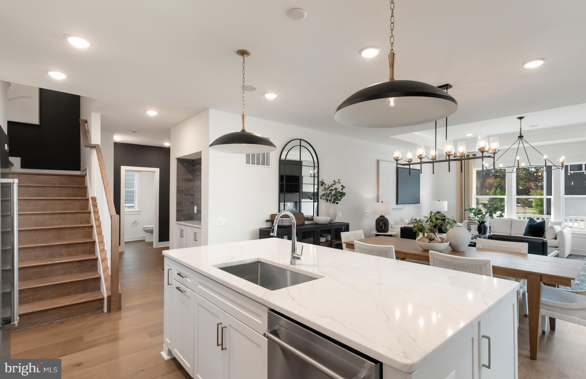 18278 Cresswell Rst Lane Leesburg, VA 20176 - Photo 11 of 63 a kitchen with kitchen island a sink stainless steel appliances and window