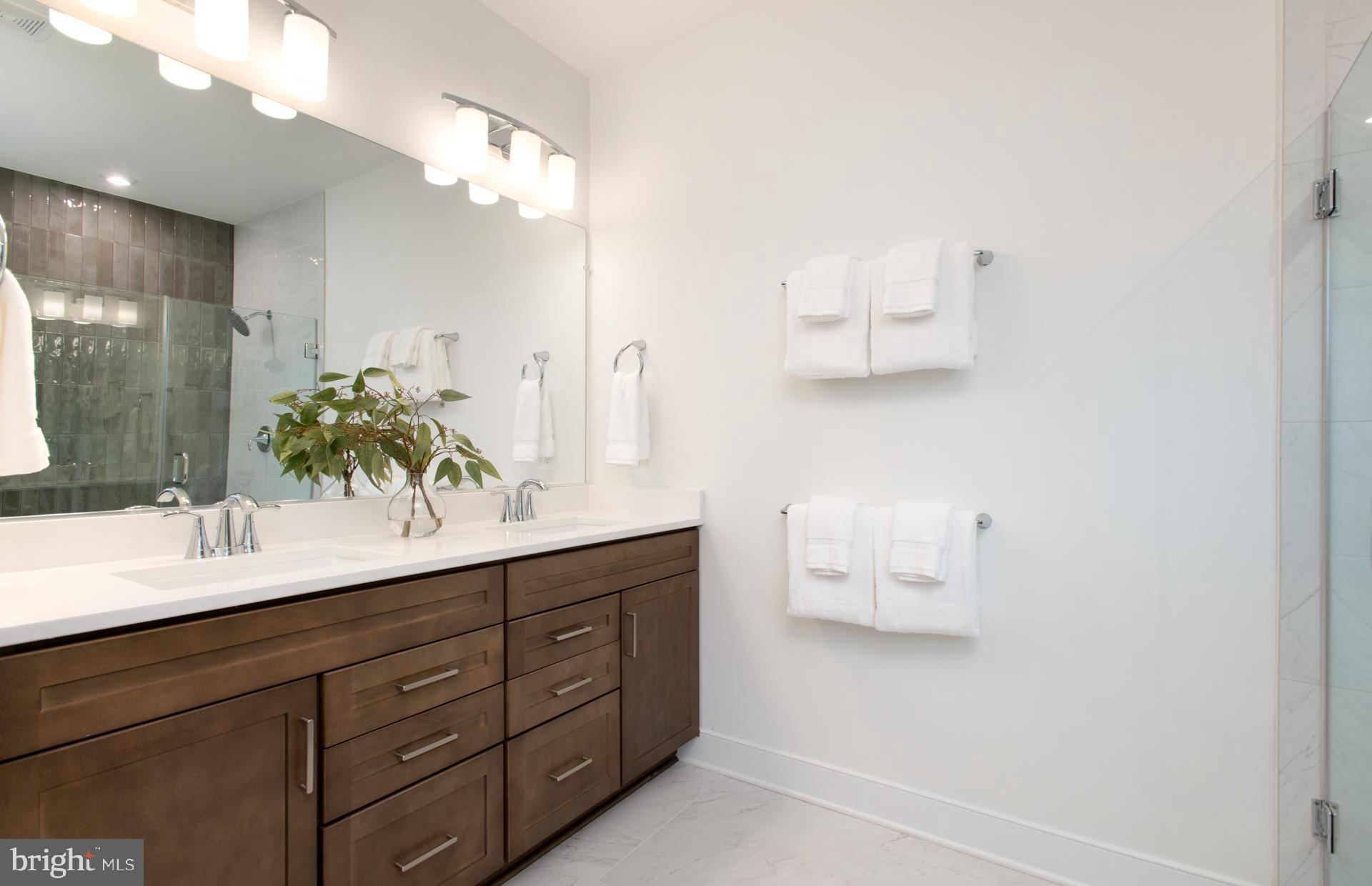 18278 Cresswell Rst Lane Leesburg, VA 20176 - Photo 28 of 63 a bathroom with a double vanity sink and mirror