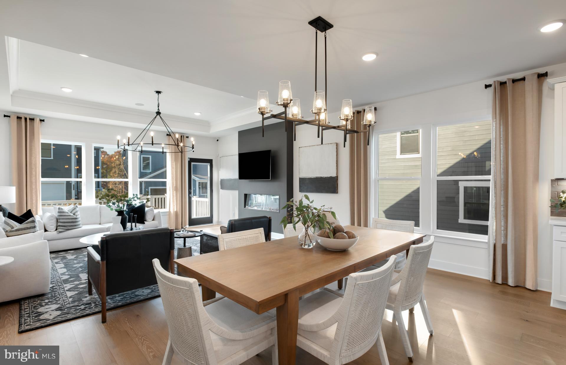 18278 Cresswell Rst Lane Leesburg, VA 20176 - Photo 4 of 63 a view of a dining room and livingroom with furniture wooden floor a chandelier