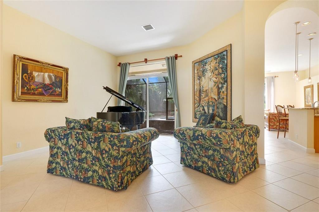 767 Southwest River Bend Circle Stuart, FL 34997 - Photo 16 of 36 a living room with furniture and a painting