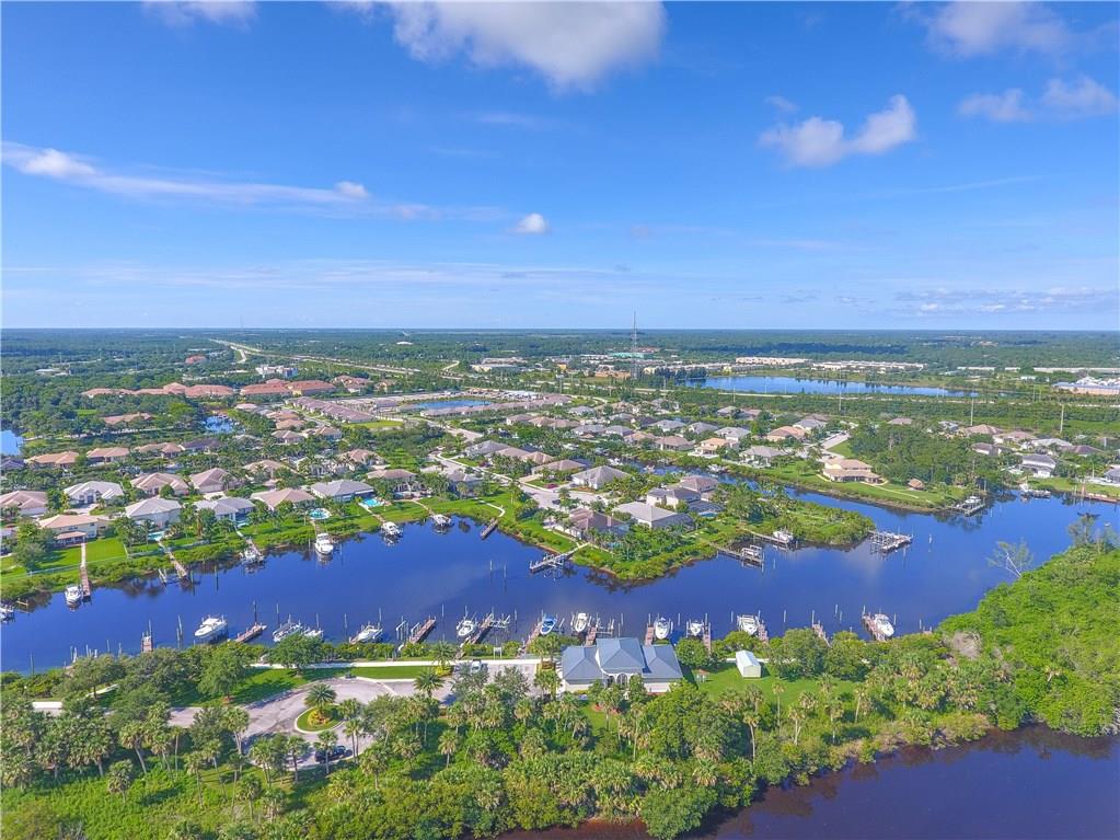 767 Southwest River Bend Circle Stuart, FL 34997 - Photo 2 of 36 an aerial view of residential houses with outdoor space and trees