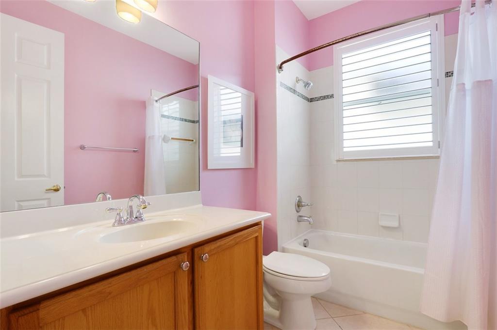 767 Southwest River Bend Circle Stuart, FL 34997 - Photo 25 of 36 a bathroom with a sink a toilet and a bathtub