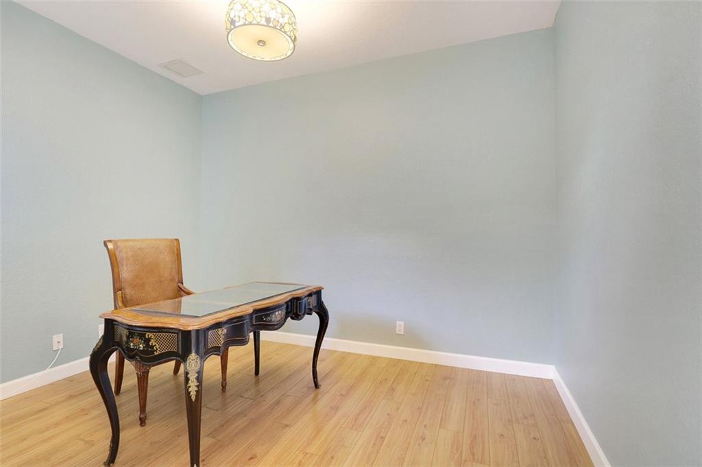 767 Southwest River Bend Circle Stuart, FL 34997 - Photo 29 of 36 a view of a room with a table and chairs