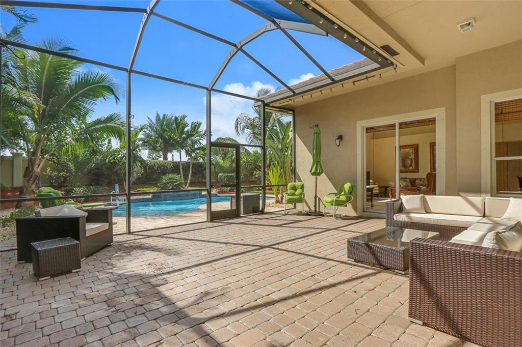 767 Southwest River Bend Circle Stuart, FL 34997 - Photo 3 of 36 a view of a couches and dinning table in patio