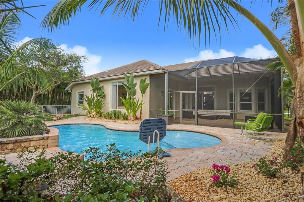 767 Southwest River Bend Circle Stuart, FL 34997 - Photo 33 of 36 a view of a house with backyard and sitting area