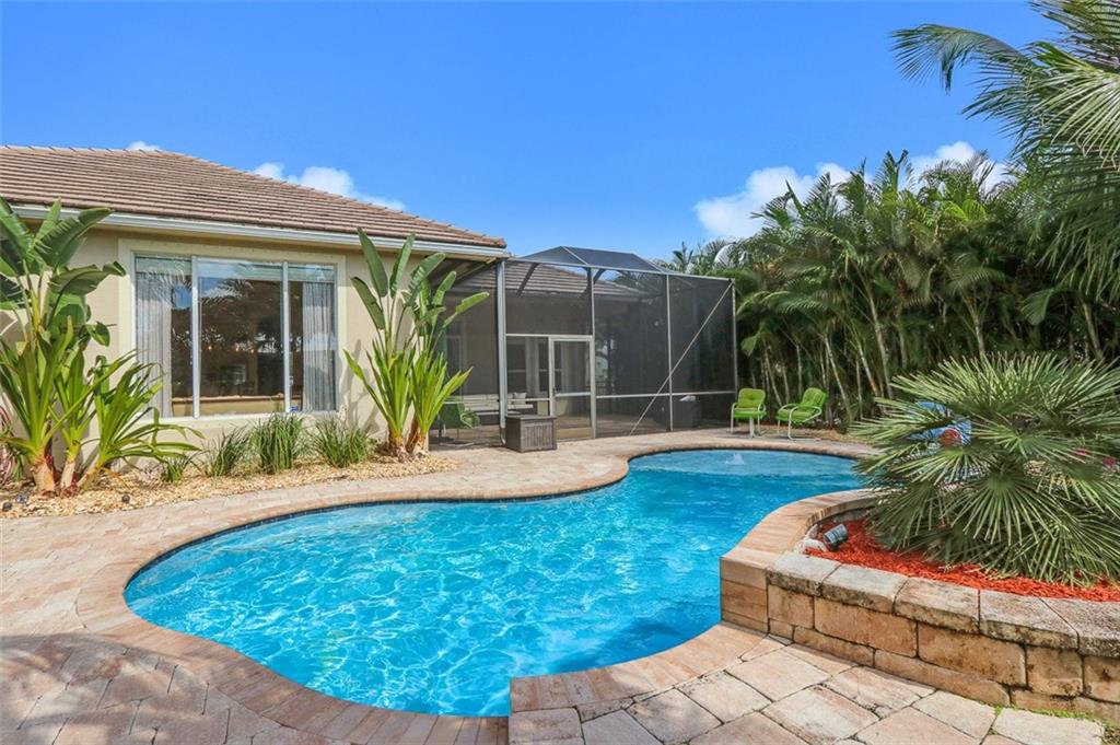 767 Southwest River Bend Circle Stuart, FL 34997 - Photo 4 of 36 a view of a house with swimming pool and sitting area