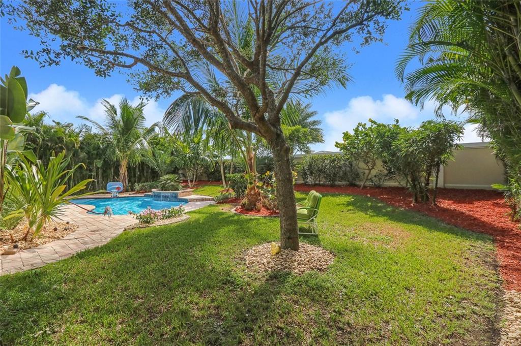 767 Southwest River Bend Circle Stuart, FL 34997 - Photo 5 of 36 a view of a backyard with large tree
