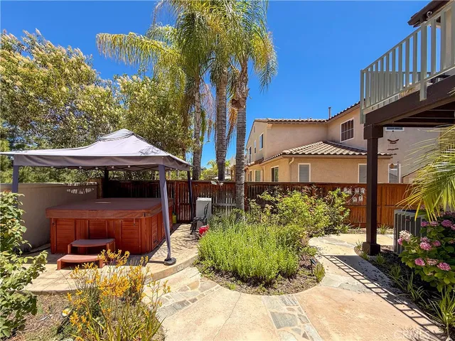 a front view of a building with sitting area
