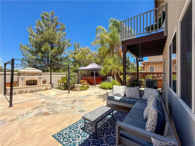 a view of a backyard with sitting area