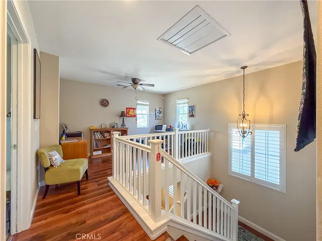 a view of staircase with furniture and windows
