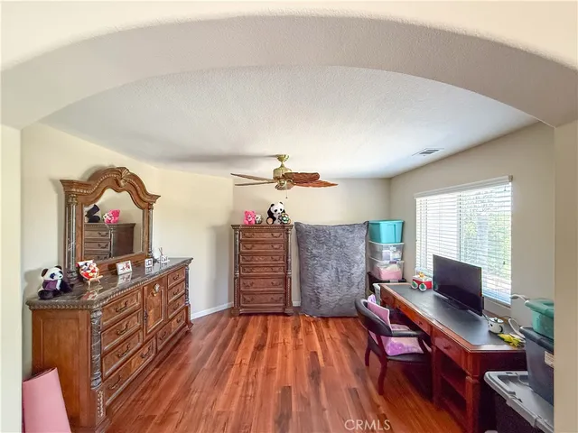 a workspace with furniture and wooden floor