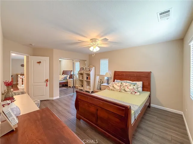 a room with a bed and a chandelier