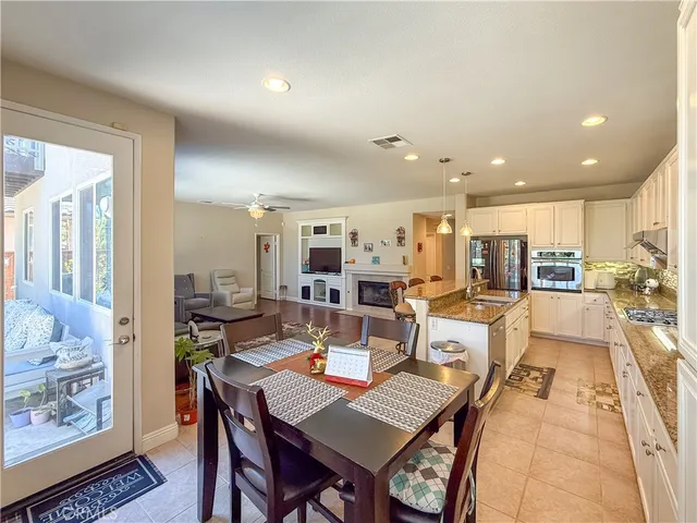 a dining room with wooden floor and a table