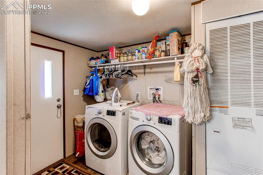 5955 Mulberry Road Calhan, CO 80808 - Photo 24 of 25 a utility room with dryer and washer