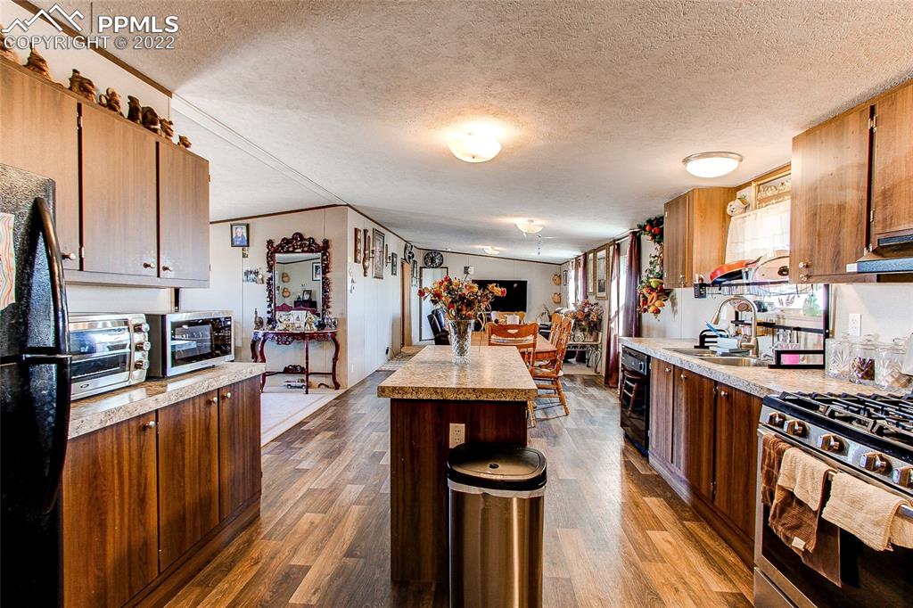 5955 Mulberry Road Calhan, CO 80808 - Photo 3 of 25 a very nice looking kitchen with many windows