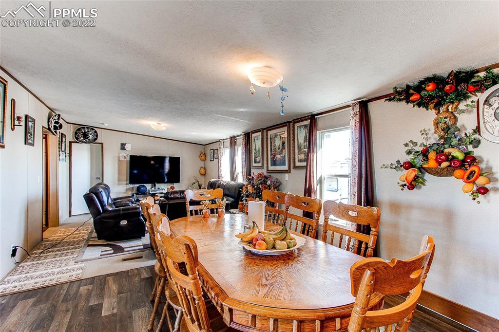 5955 Mulberry Road Calhan, CO 80808 - Photo 7 of 25 a view of a dining room with furniture window and outside view