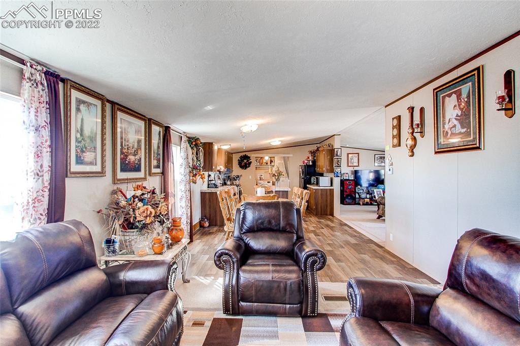 5955 Mulberry Road Calhan, CO 80808 - Photo 8 of 25 a living room with furniture and a large window