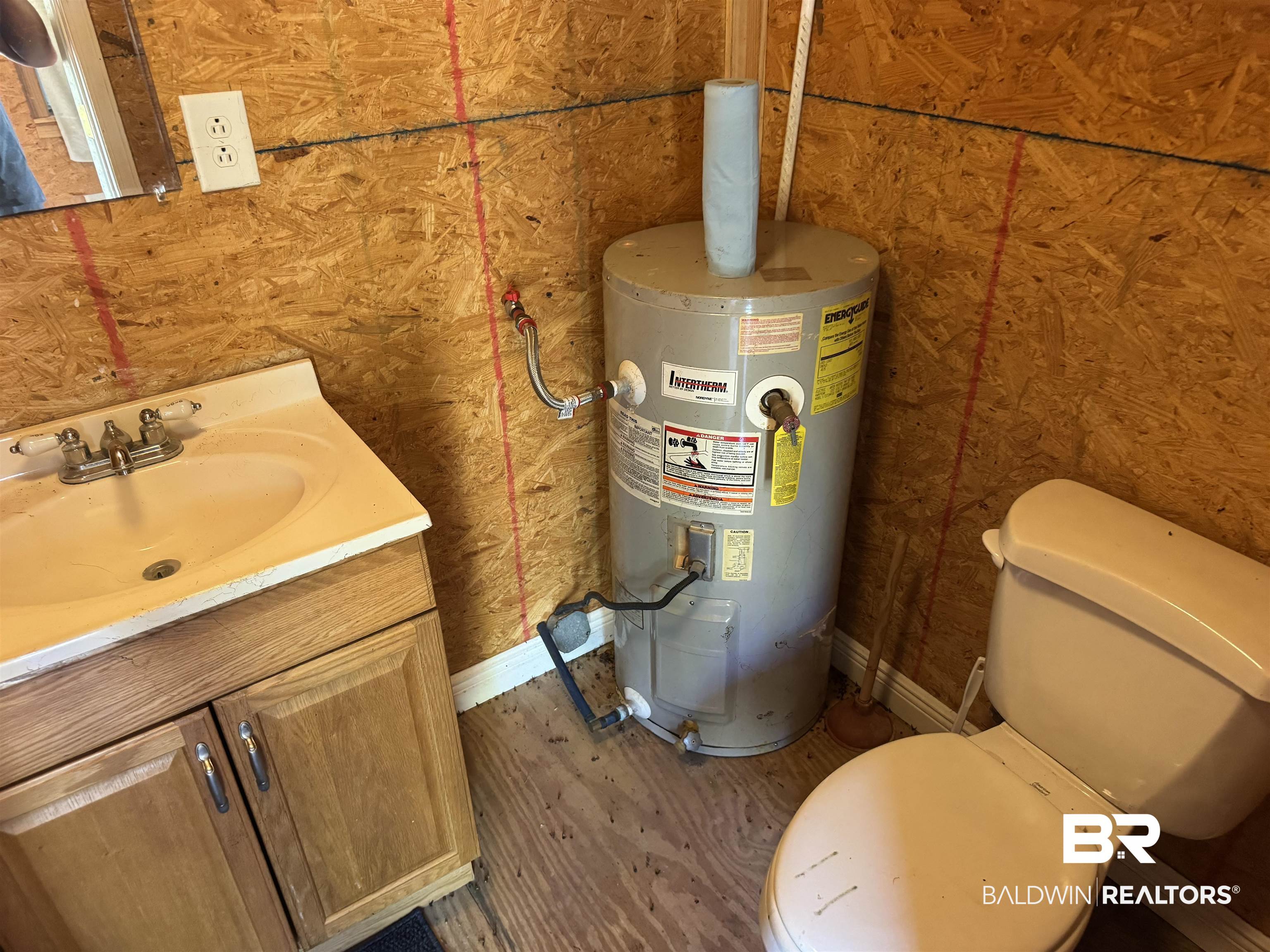 516 Mill Creek Road Frisco City, AL 36445 - Photo 8 of 32 Utility room with water heater and a sink