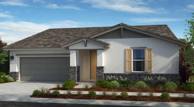 a front view of a house with garage