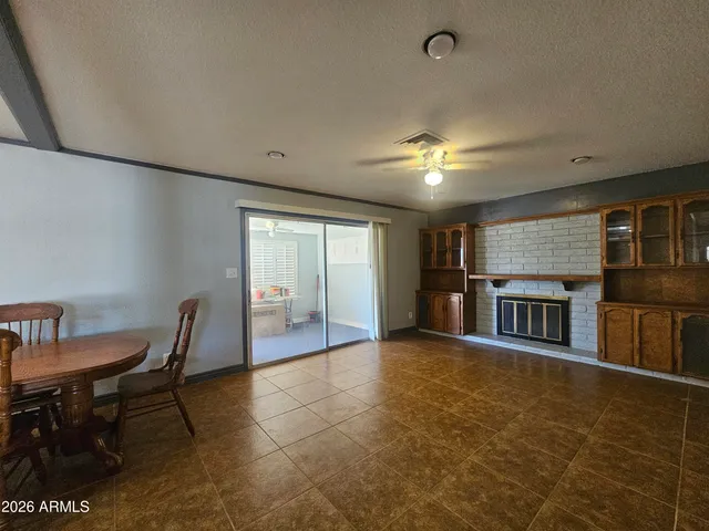 a view of a livingroom with furniture and a ceiling fan