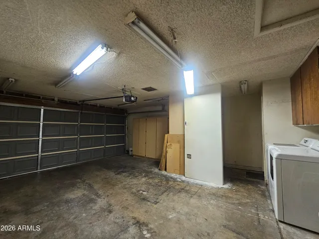 a view of an empty room with a fireplace